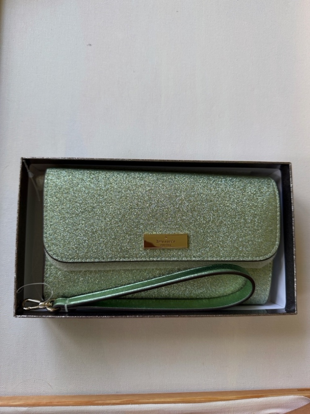 Kenzie boxed glitter medium flap phone wristlet in the color seawater